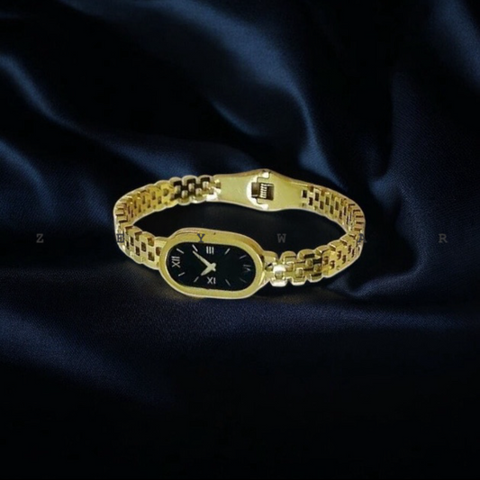 Golden vintage watch style bracelet with black dial